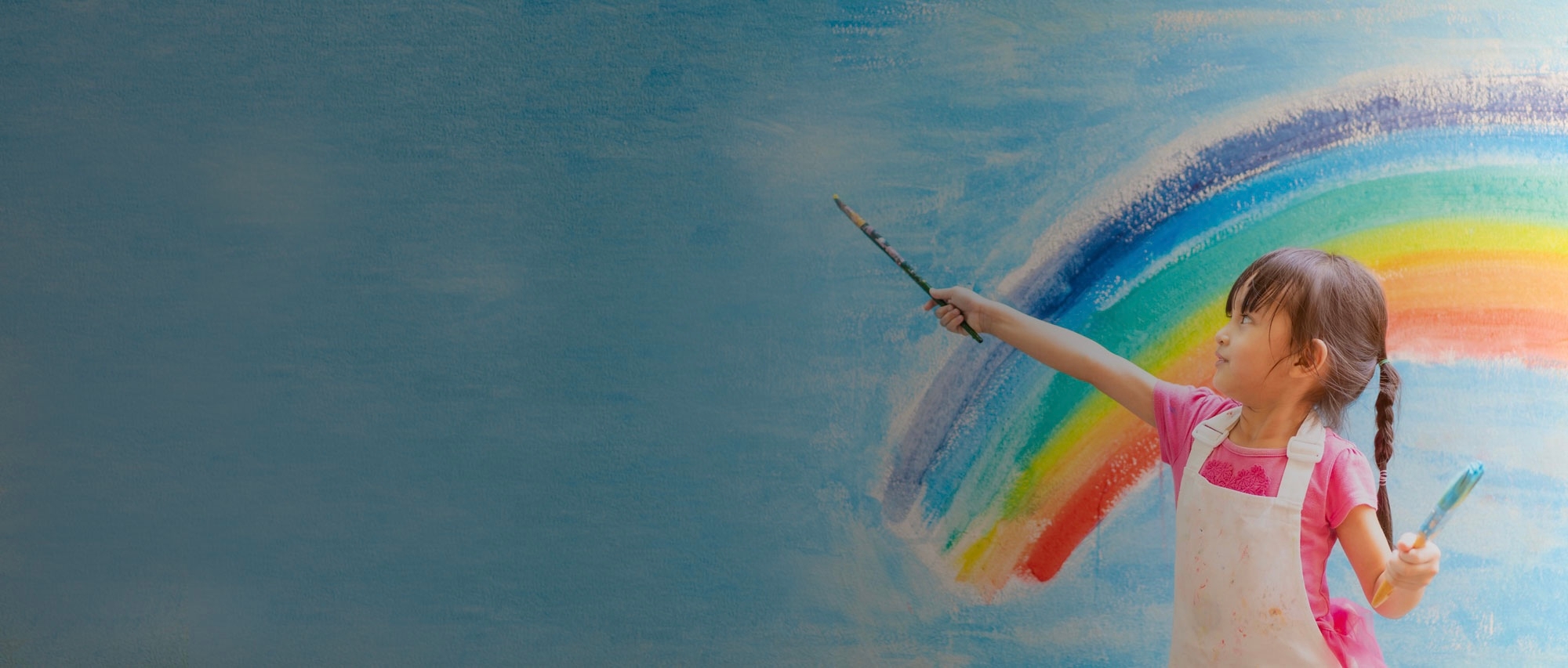 A girl painting a rainbow